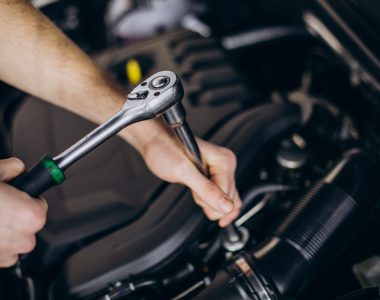 Repair man making car service